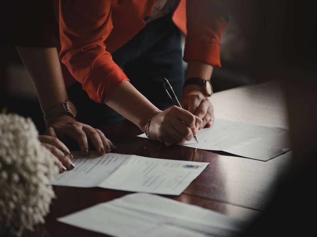 People reviewing and signing legal documents